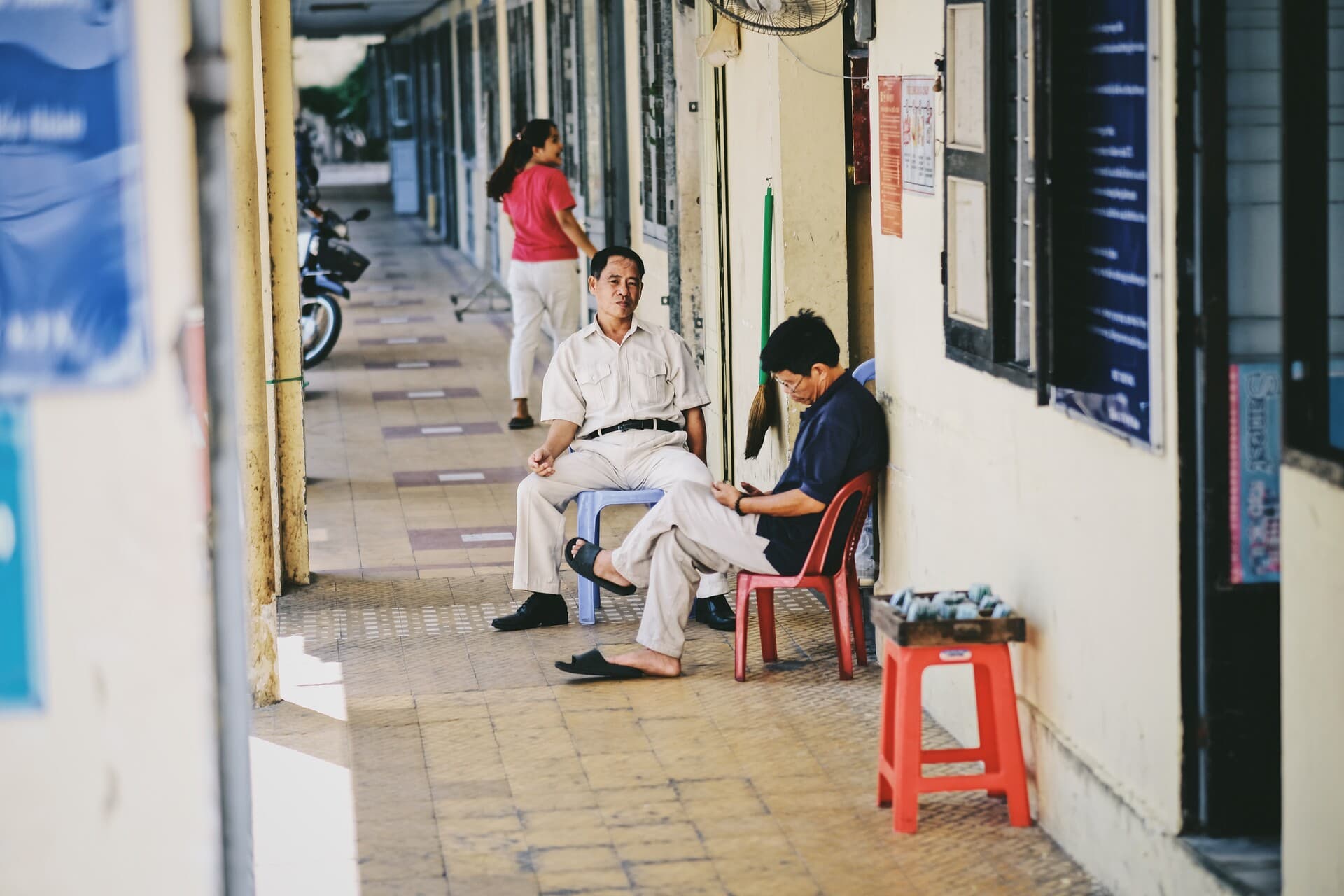 Two people sitting idle