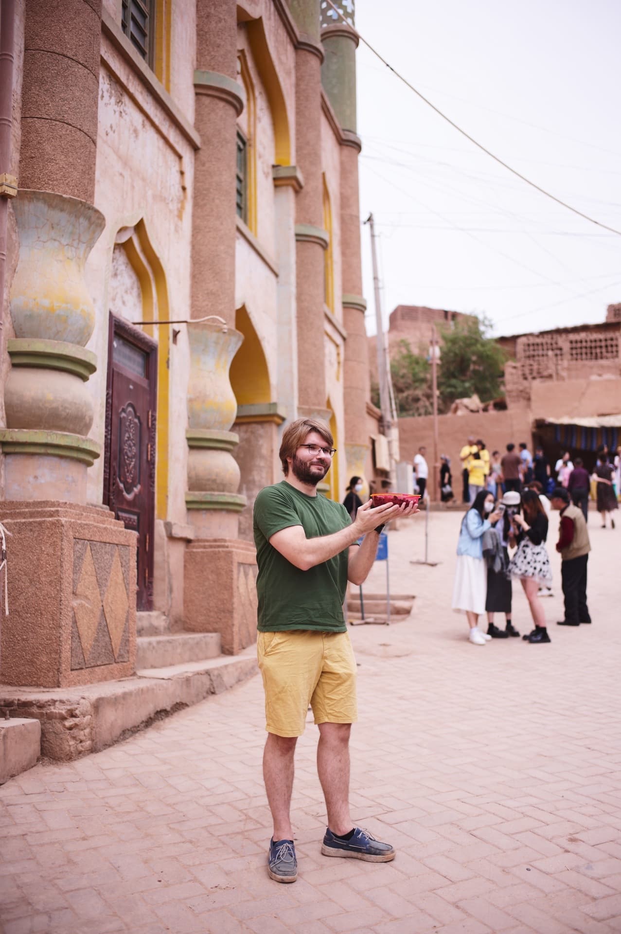 The man holding fruits in his hands